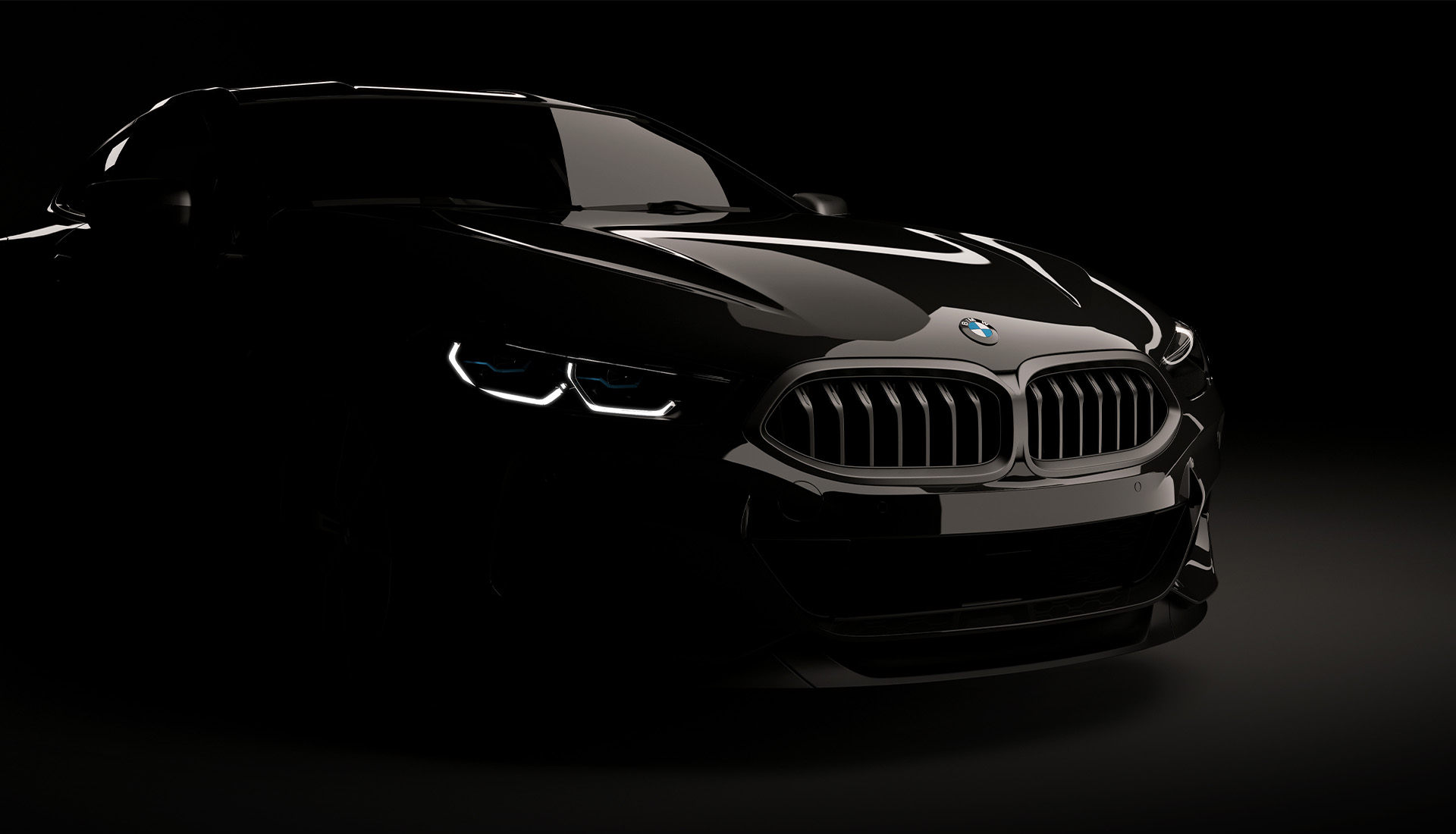 Sleek black BMW sports car partially illuminated against a dark background, showcasing its iconic kidney grille and distinctive headlights.