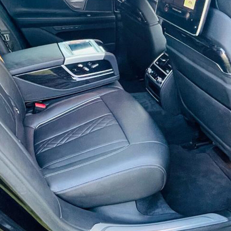 Black leather rear seats of an executive car