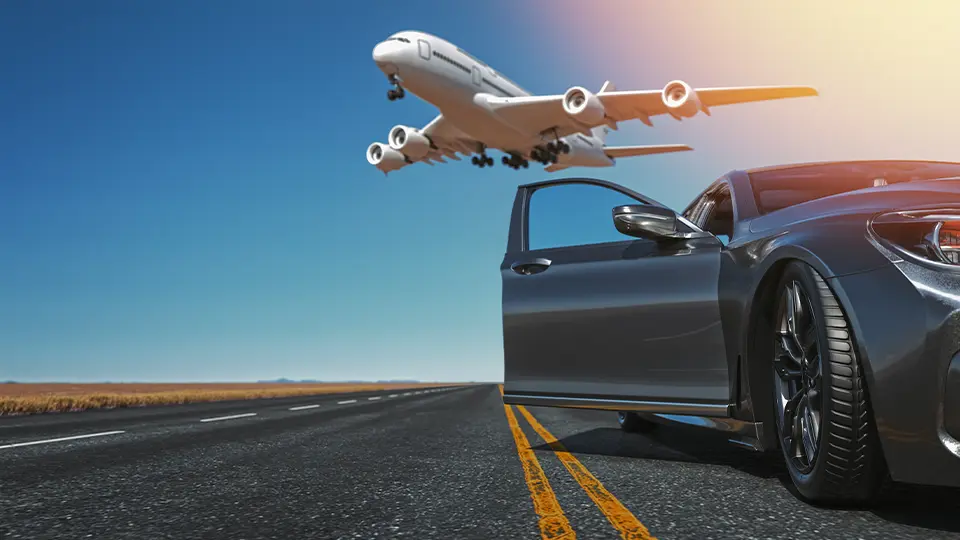 An aircraft over a chauffeur car at an airport